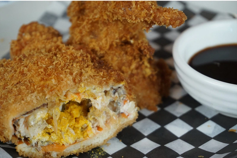 Spicy tuna roll with signature sauce at Momoyama Sushi Calgary, AB